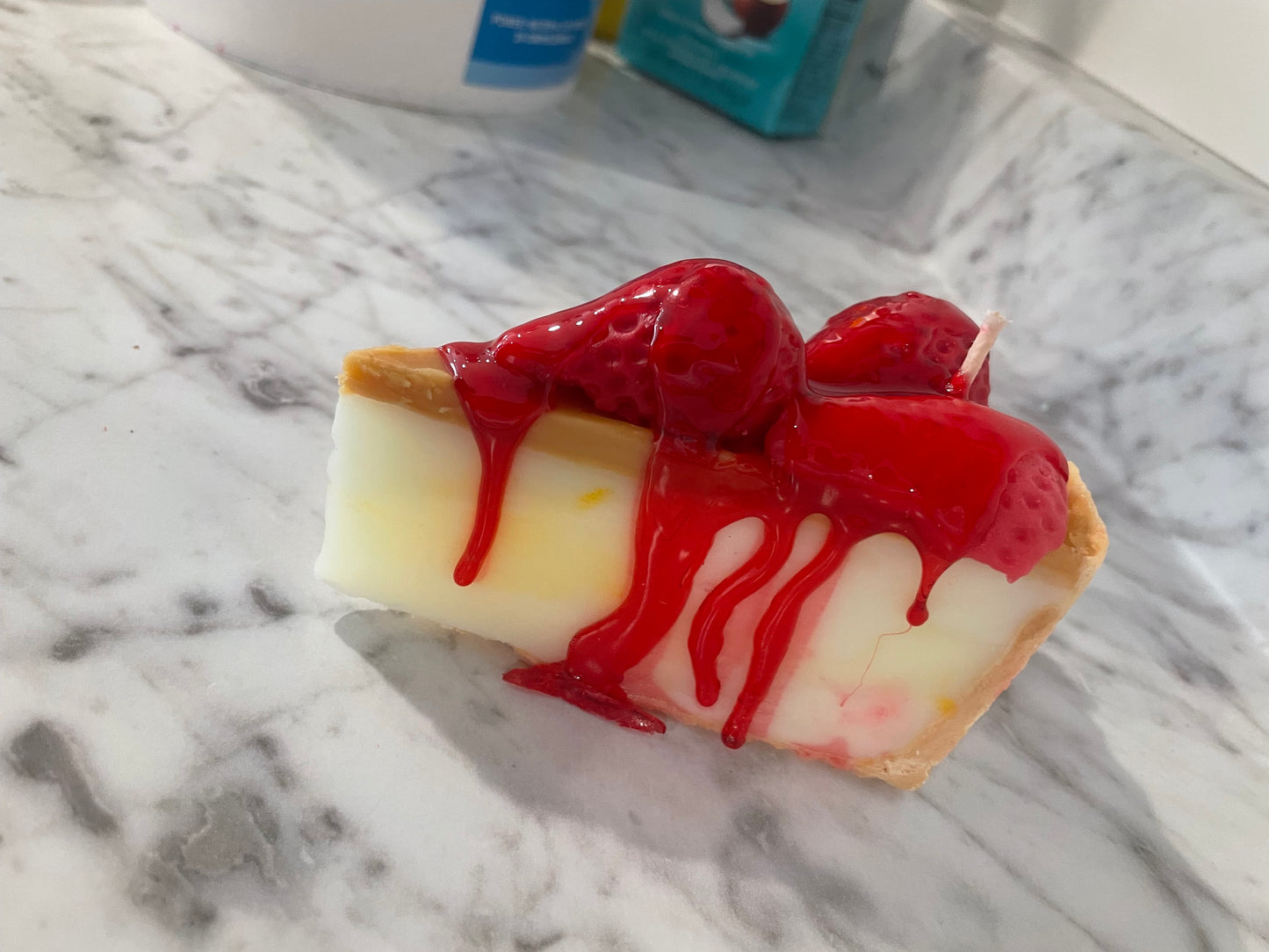 Slice of cherry cheesecake candle
