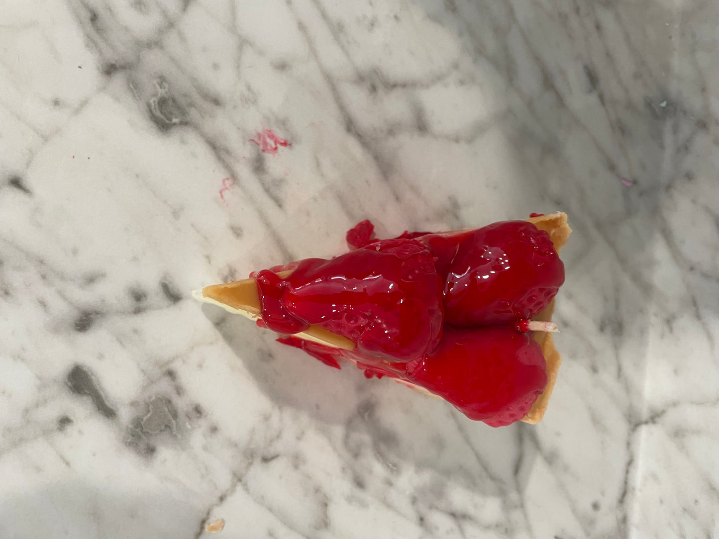 Slice of cherry cheesecake candle
