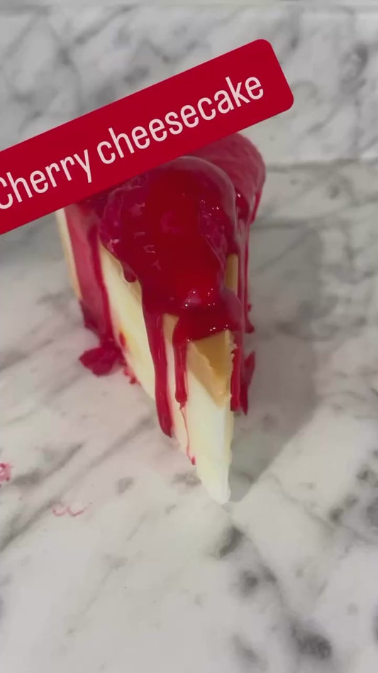 Slice of cherry cheesecake candle